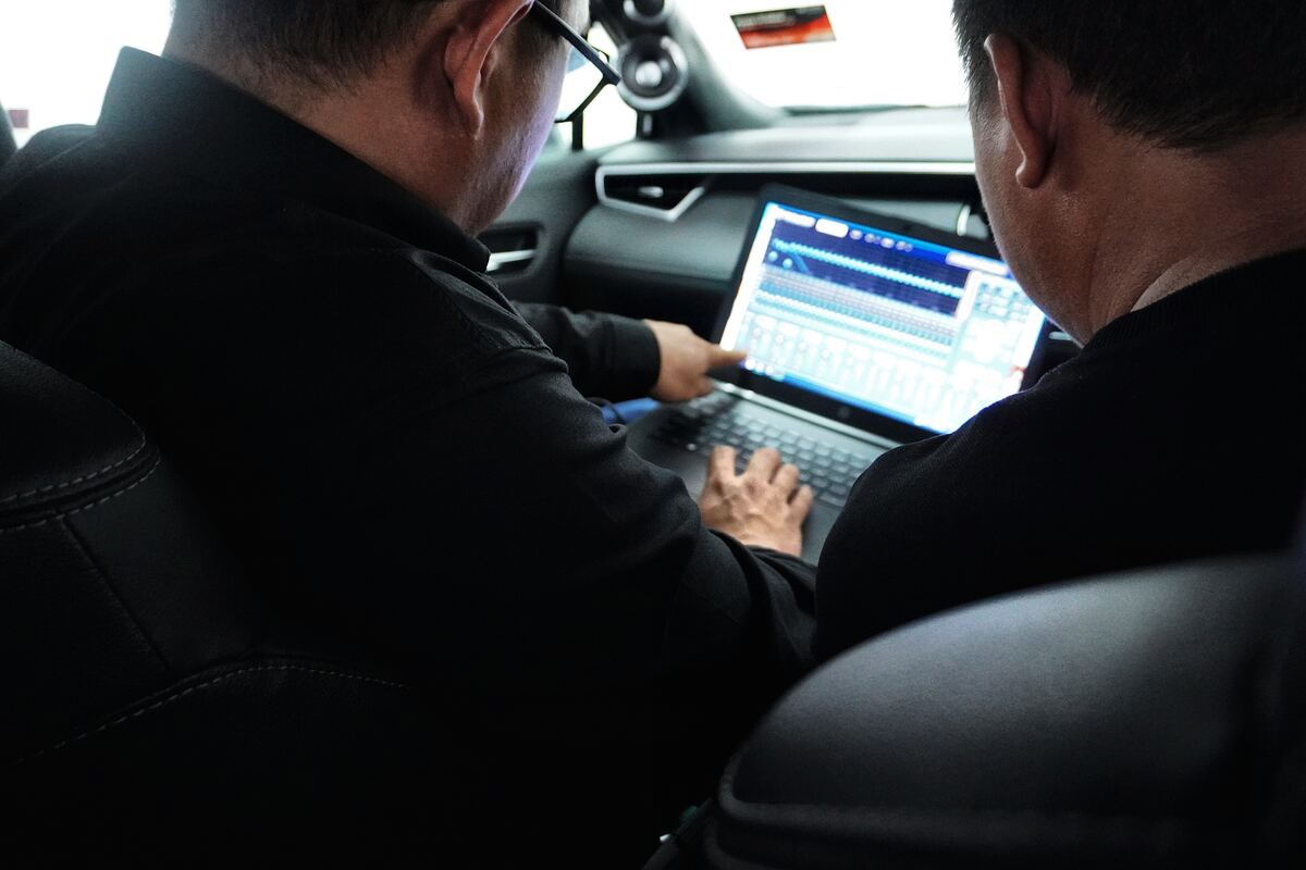 Close-up of DSP tuning software running on a laptop in-car.